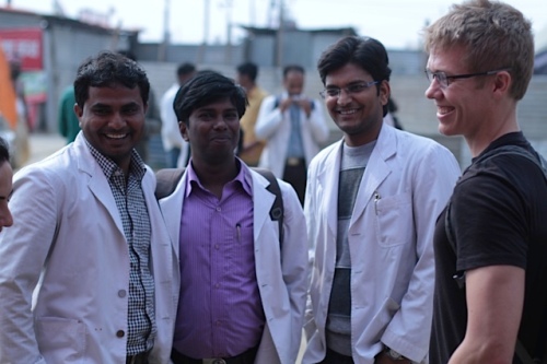 Local medical students talk with project leader Aaron Heerboth.